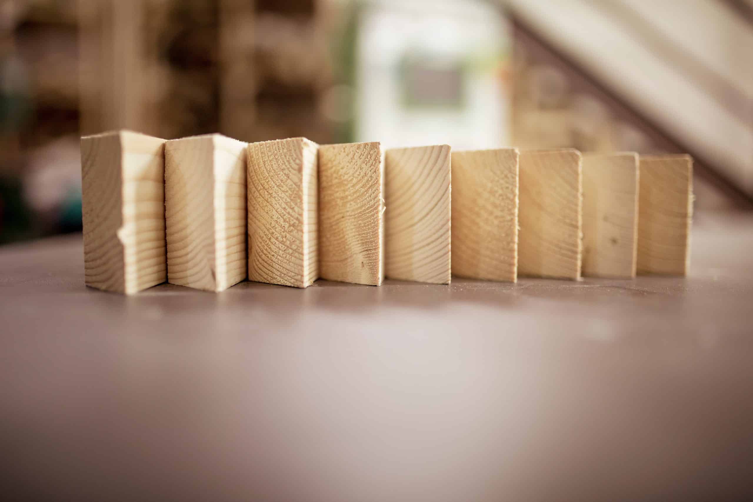 Surface level of wood arranged side by side on table in workshop