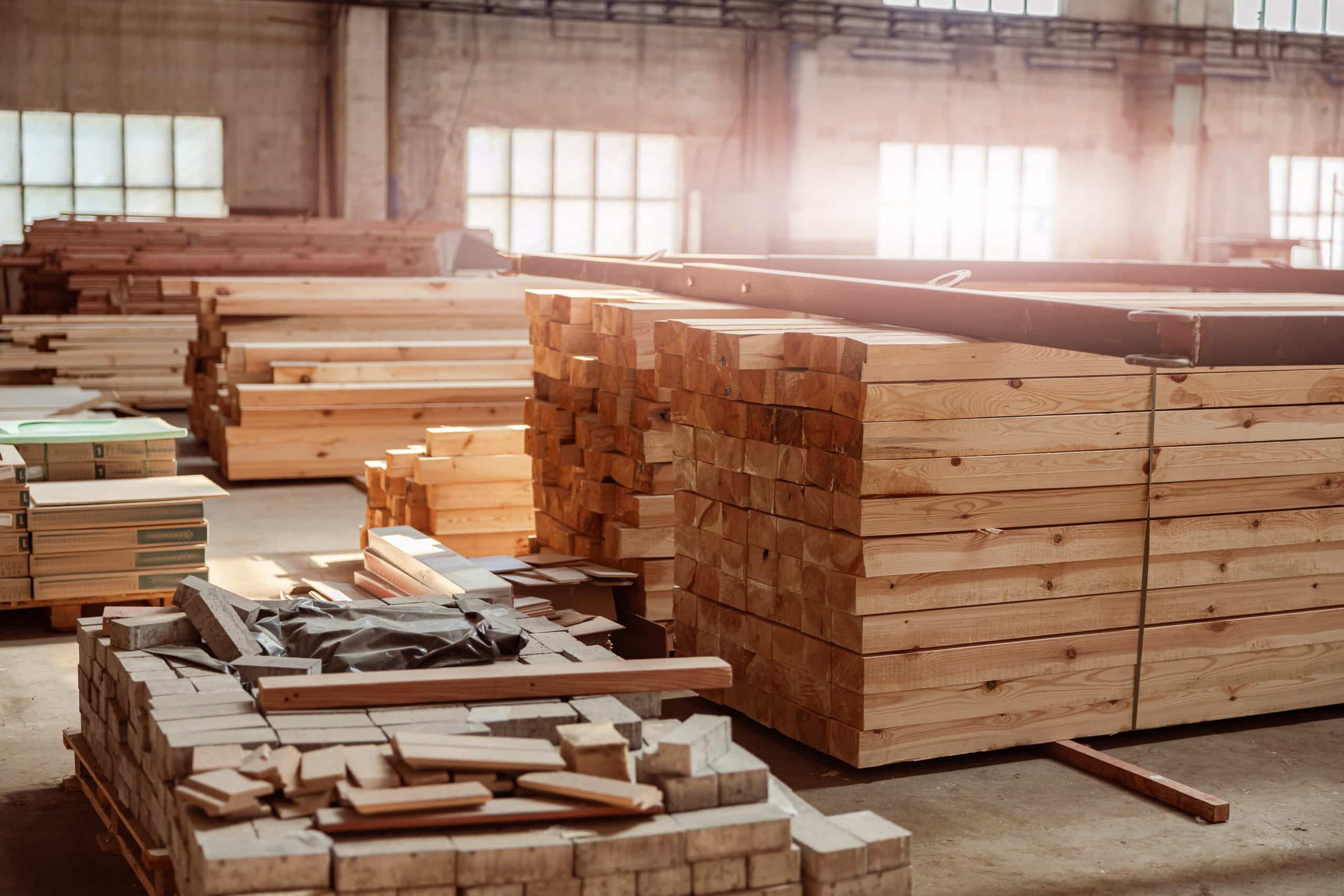 Wood planks and bricks for house building storing at construction site